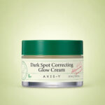 کرم ضد لک اکسیس وای Dark Spot Correcting Glow Cream با بسته‌بندی سفید و سبز