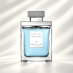 بطری عطر ماین پور هوم مارک جوزف با مایع آبی روشن، شیشه شفاف و درپوش نقره‌ای